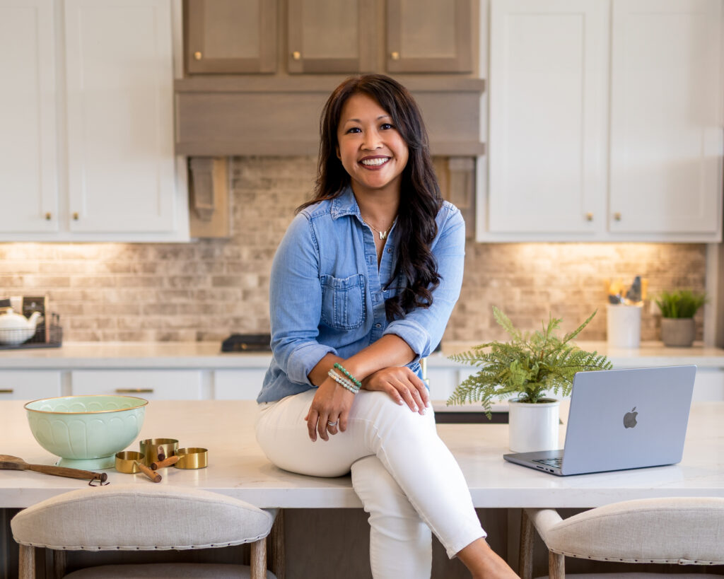 Meisie Beauvais Seasoned Marketing Strategist sitting in the kitchen